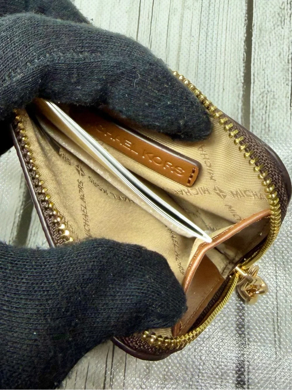 Michael Kors wallet logo